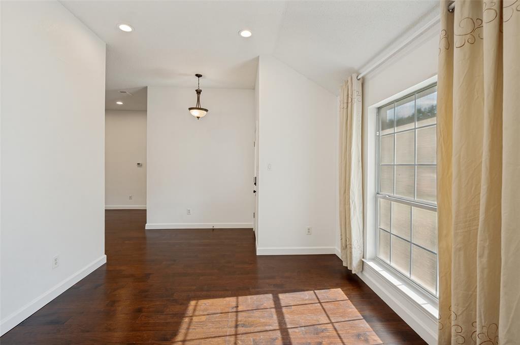 8160 Tower Road Frisco, TX 75035 - Photo 5 of 25 a view of a hallway with wooden floor and a bathroom
