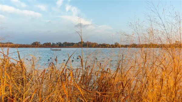 a view of ocean with a large bridge
