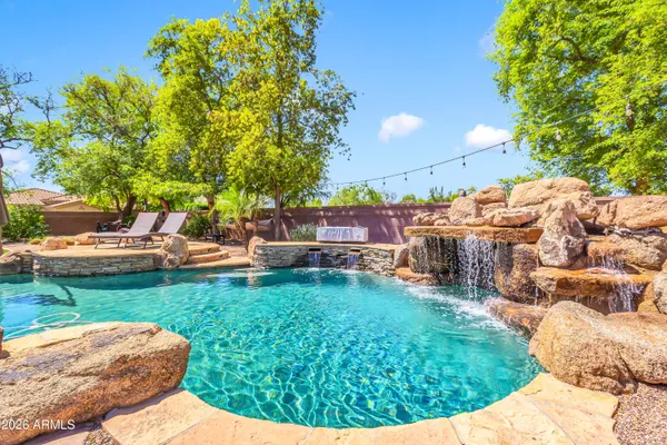 a backyard of a house with yard and outdoor seating