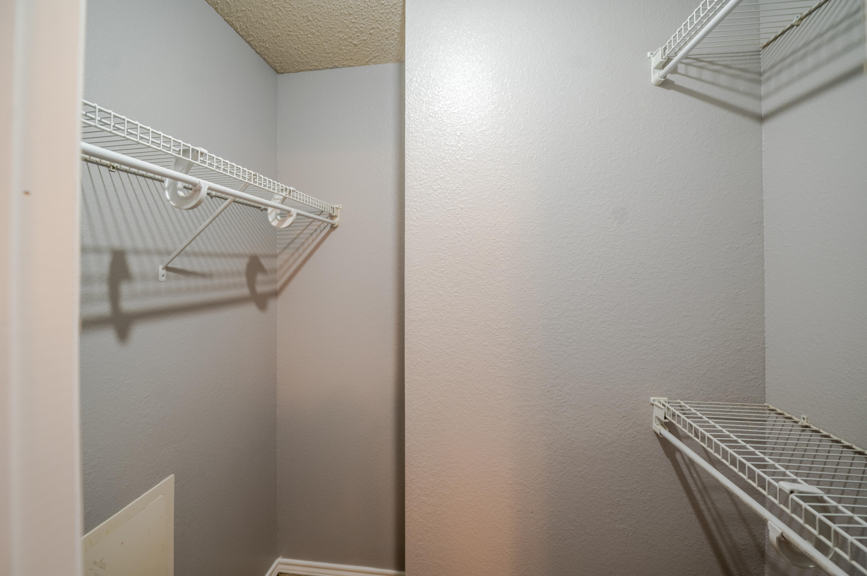2111 Main Street, Unit 1 Lubbock, TX 79401 - Photo 27 of 36 a view of a room with racks on the wall