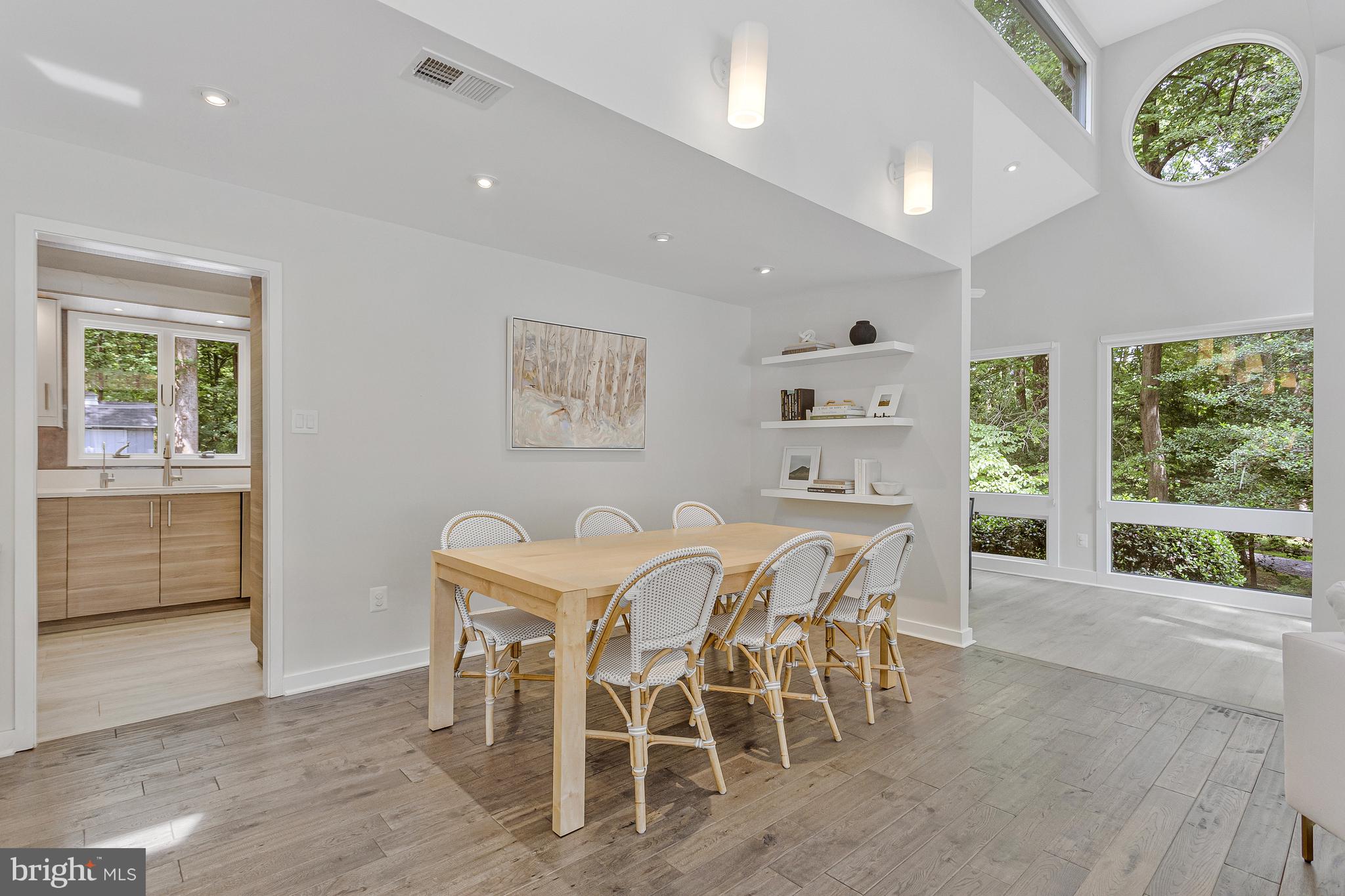 718 Springvale Road Great Falls, VA 22066 - Photo 11 of 57 a dining room with furniture and a floor to ceiling window