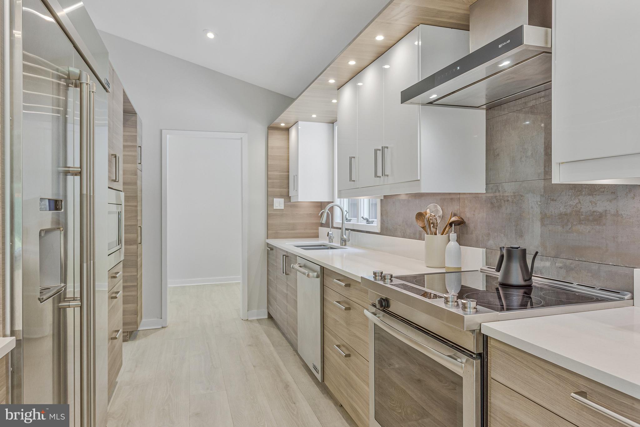 718 Springvale Road Great Falls, VA 22066 - Photo 13 of 57 a kitchen with a sink and cabinets