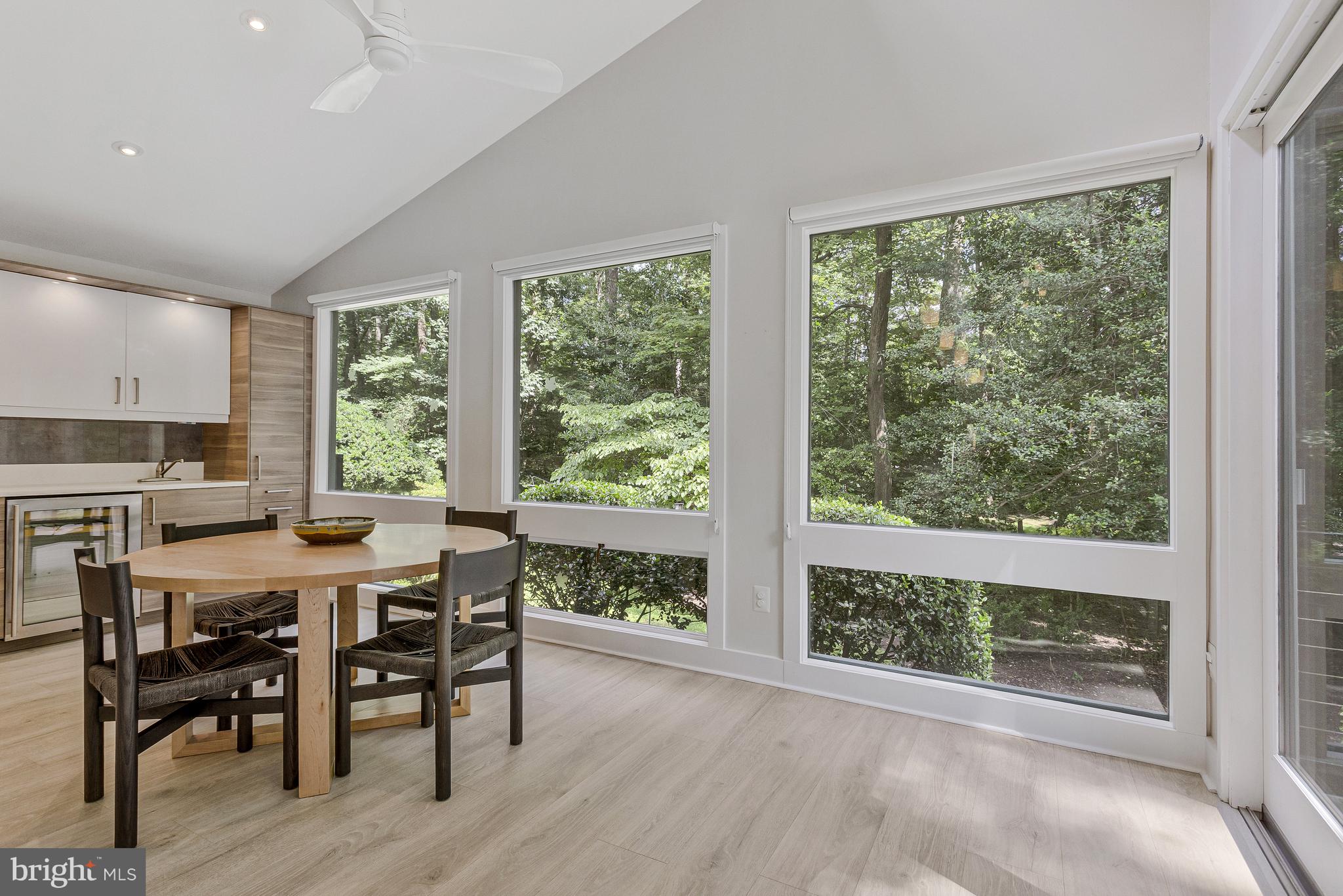718 Springvale Road Great Falls, VA 22066 - Photo 16 of 57 a view of a dining room with furniture and wooden floor