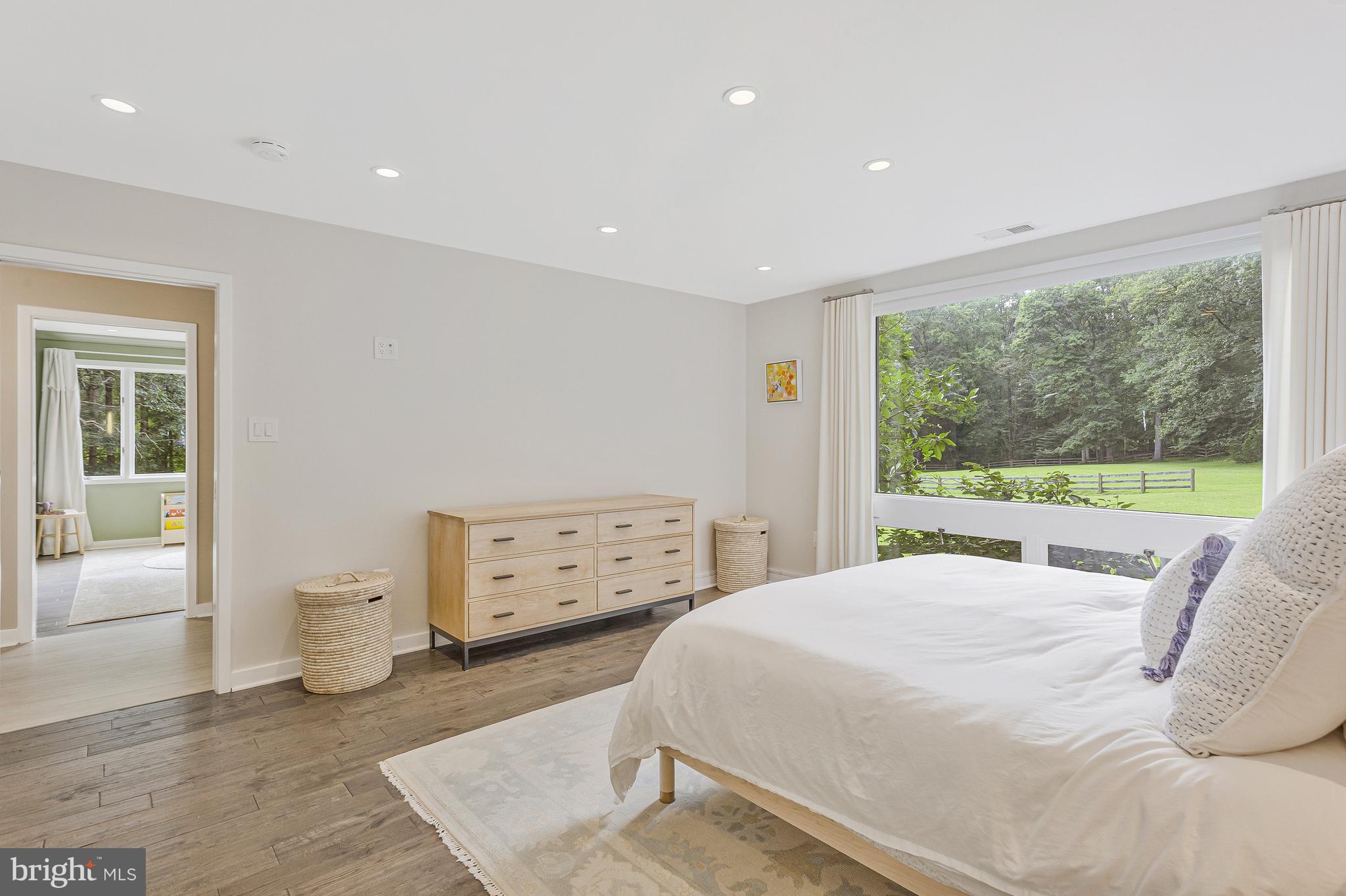 718 Springvale Road Great Falls, VA 22066 - Photo 20 of 57 a bedroom with a bed and wooden floor