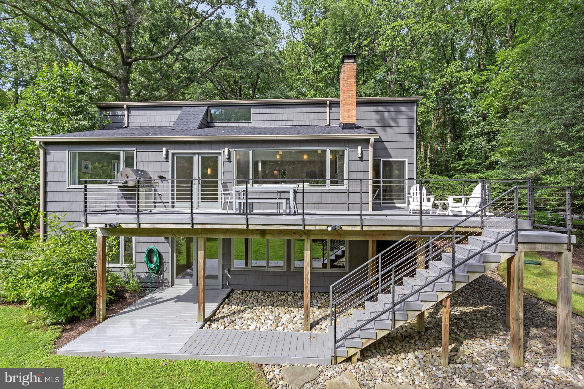 718 Springvale Road Great Falls, VA 22066 - Photo 2 of 57 a view of house with a chairs and table in a patio