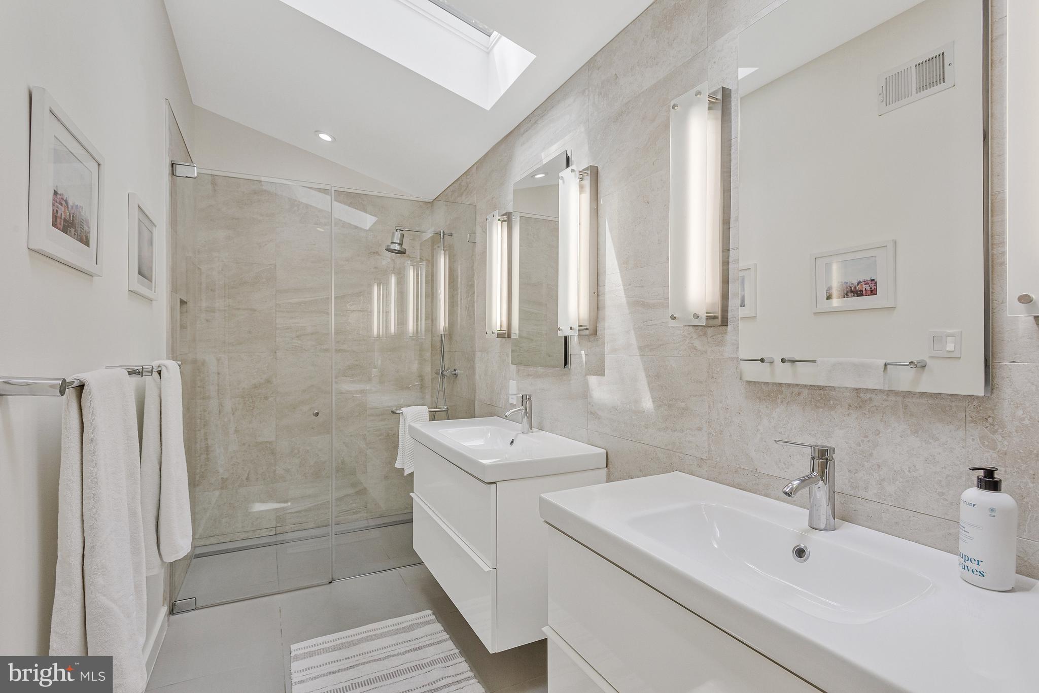 718 Springvale Road Great Falls, VA 22066 - Photo 22 of 57 a bathroom with a sink a toilet and shower