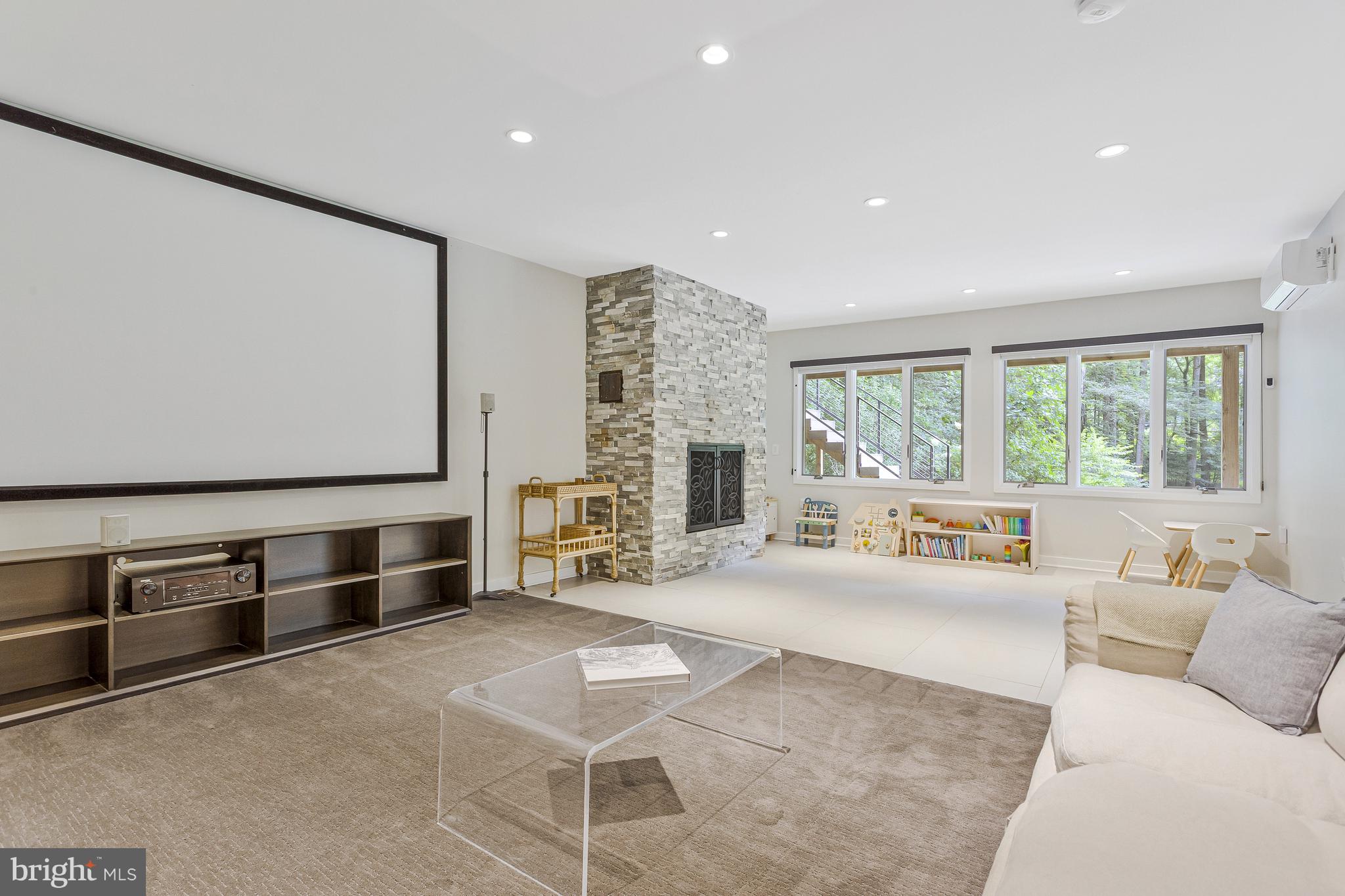 718 Springvale Road Great Falls, VA 22066 - Photo 29 of 57 a living room with furniture large window and flat screen tv