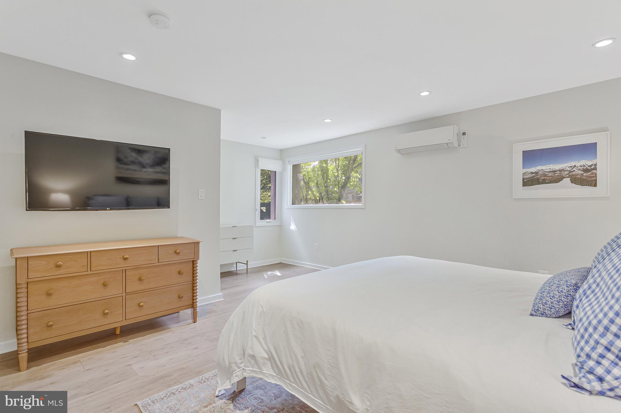 718 Springvale Road Great Falls, VA 22066 - Photo 34 of 57 a bedroom with a large bed and a flat screen tv