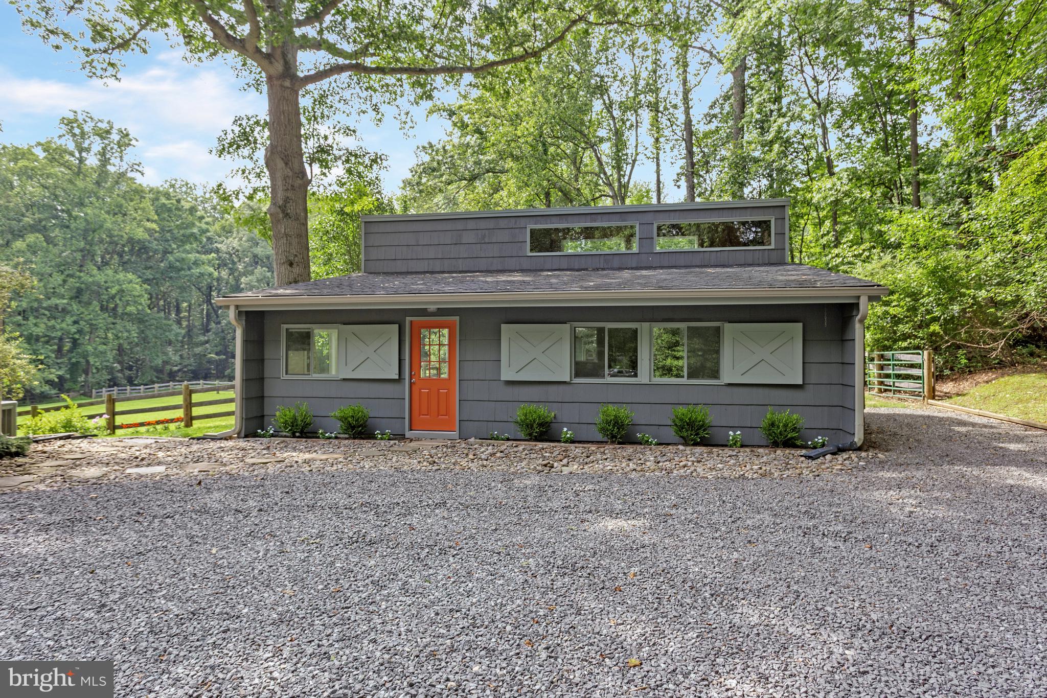 718 Springvale Road Great Falls, VA 22066 - Photo 37 of 57 a front view of a house with garden