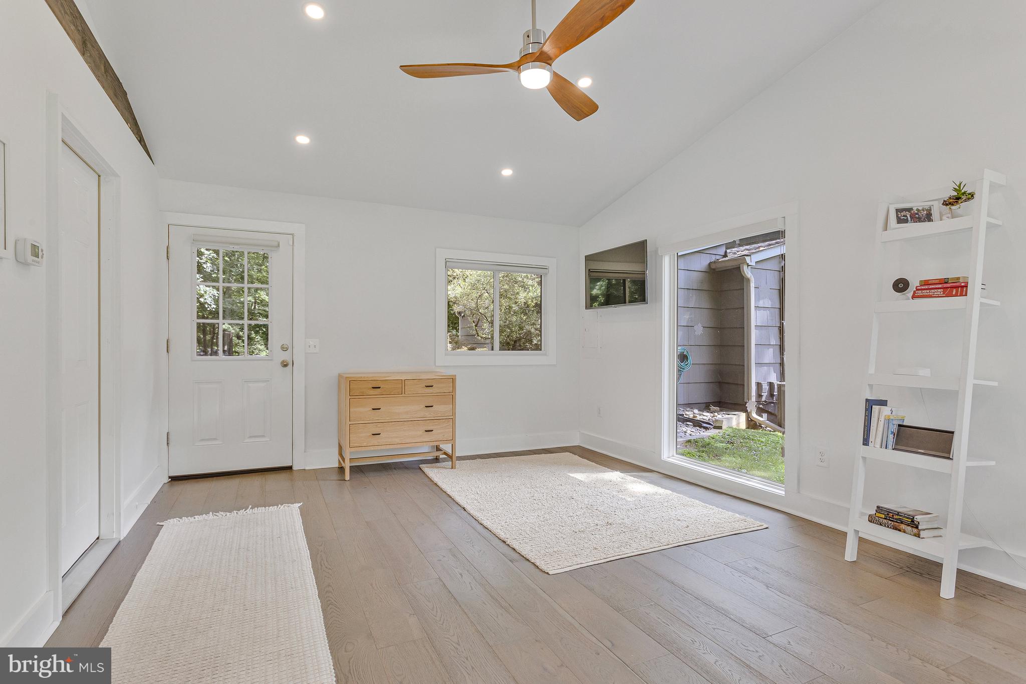 718 Springvale Road Great Falls, VA 22066 - Photo 39 of 57 an empty room with wooden floor and windows