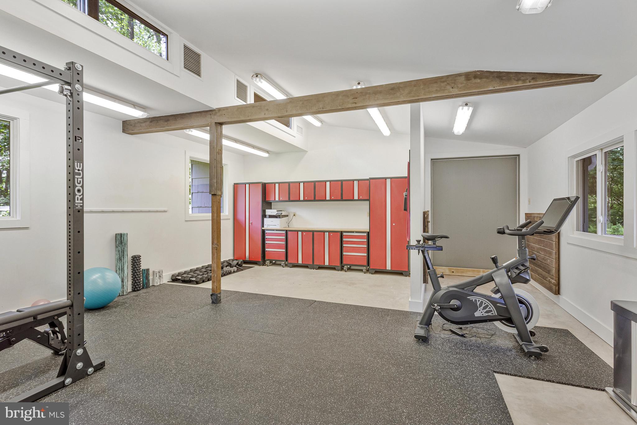 718 Springvale Road Great Falls, VA 22066 - Photo 40 of 57 a room with gym equipment and a large window