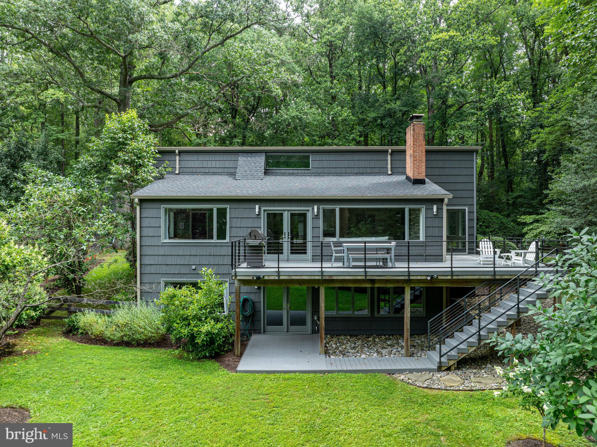 718 Springvale Road Great Falls, VA 22066 - Photo 56 of 57 a front view of house with a garden