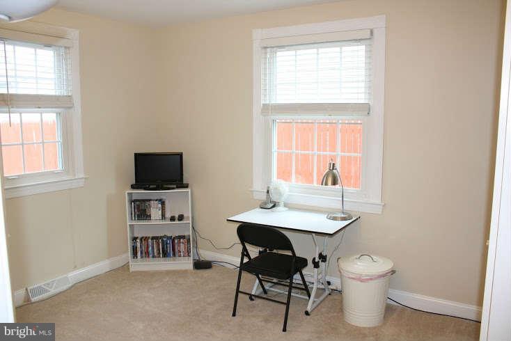8124 Cornwall Road Baltimore, MD 21222 - Photo 14 of 29 a view of a workspace with furniture and a window