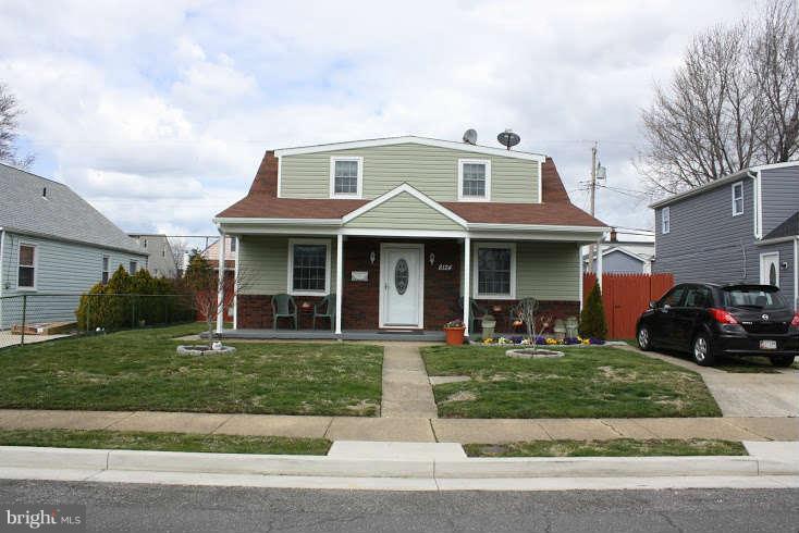 8124 Cornwall Road Baltimore, MD 21222 - Photo 3 of 29 a front view of a house with a yard