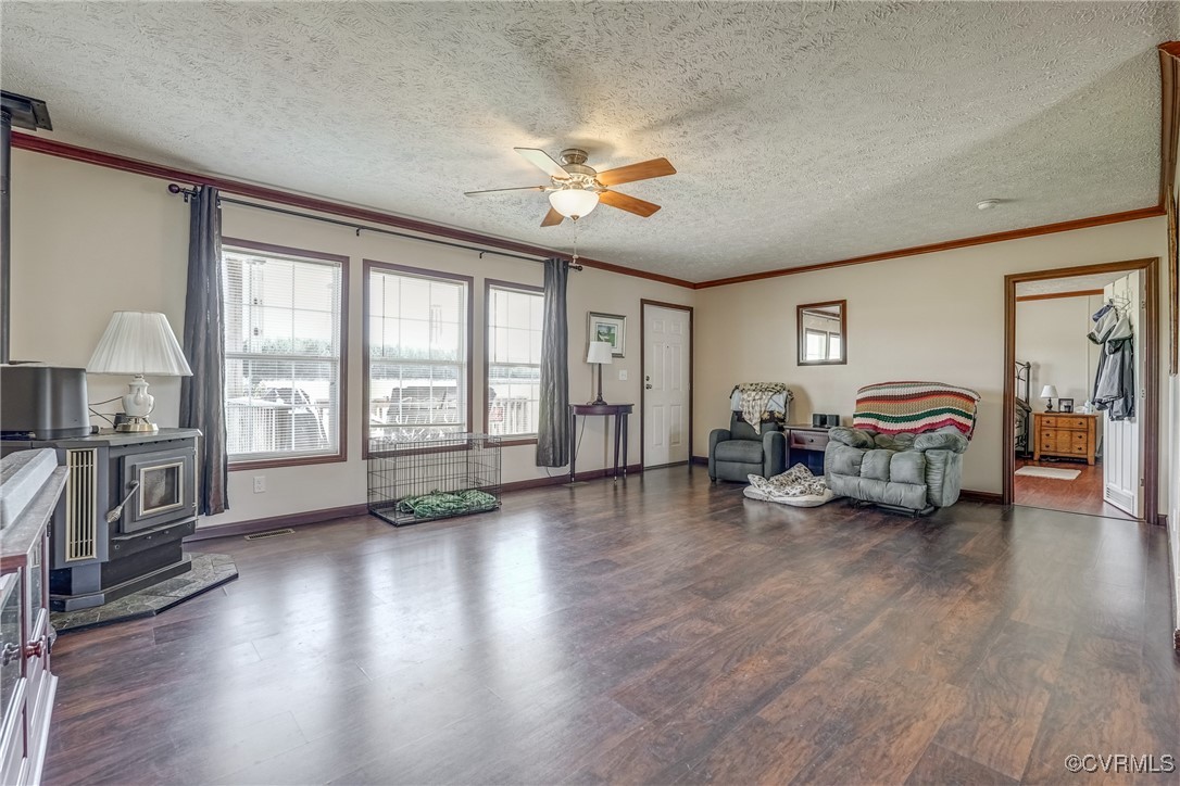 6779 South Hill Road Kenbridge, VA 23944 - Photo 14 of 50 Living room featuring ceiling fan, ornamental mold