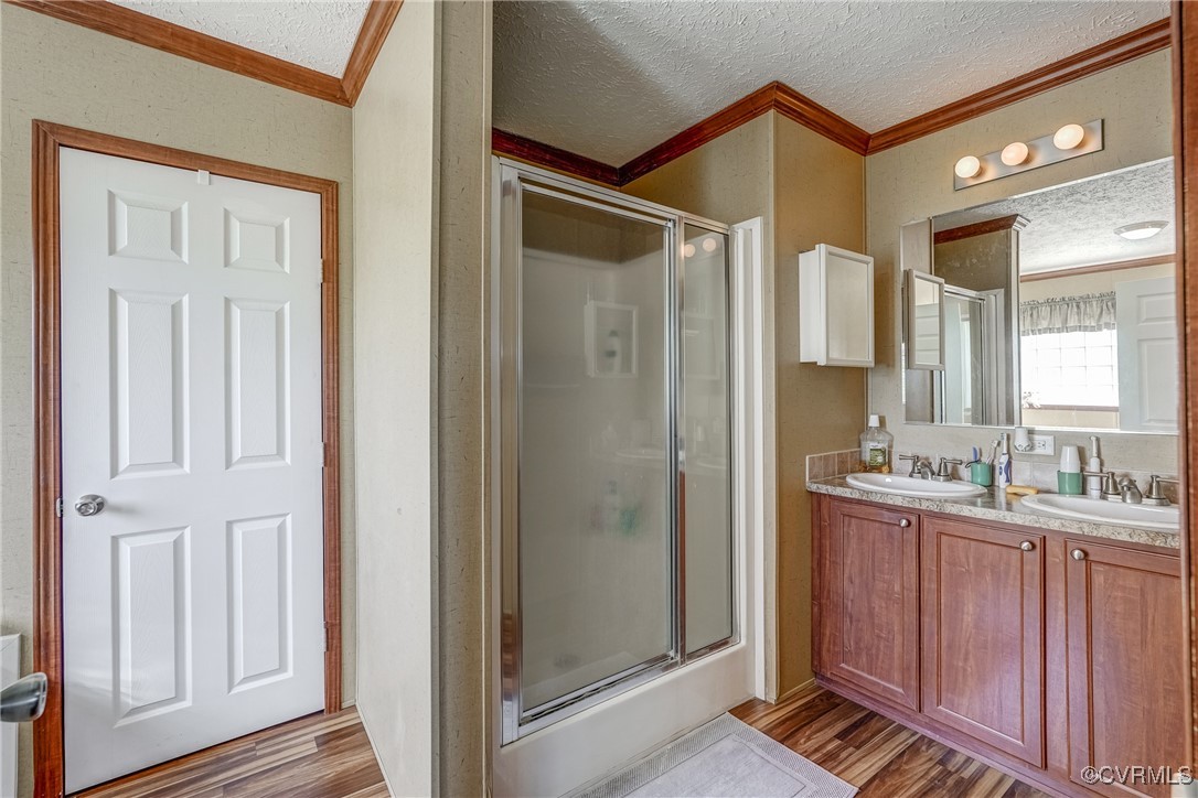6779 South Hill Road Kenbridge, VA 23944 - Photo 19 of 50 Bathroom with vanity, an enclosed shower, and hard