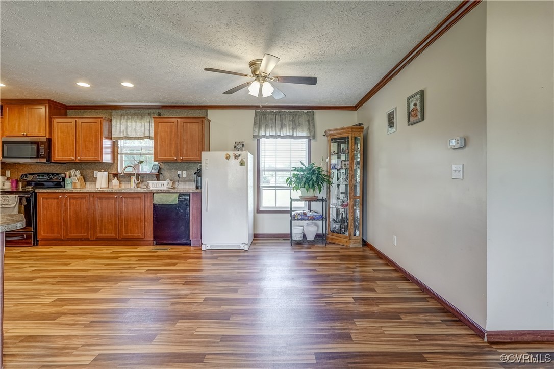 6779 South Hill Road Kenbridge, VA 23944 - Photo 23 of 50 Kitchen featuring black appliances, light hardwood