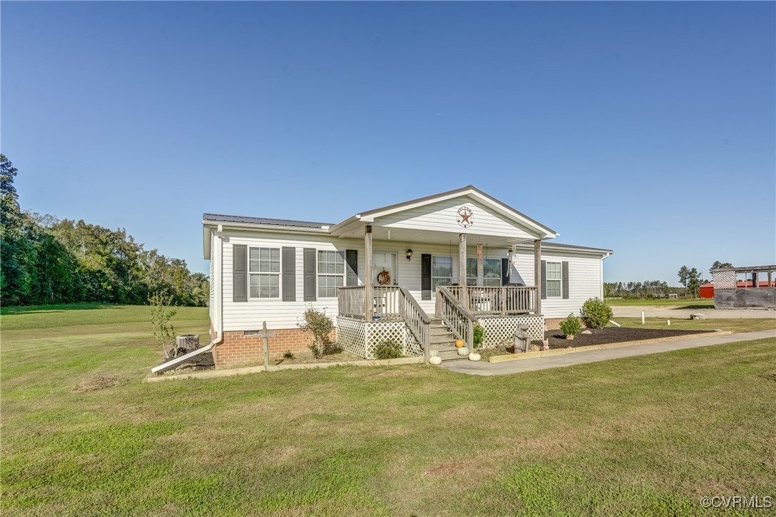 6779 South Hill Road Kenbridge, VA 23944 - Photo 6 of 50 View of front facade with a porch and a front yard