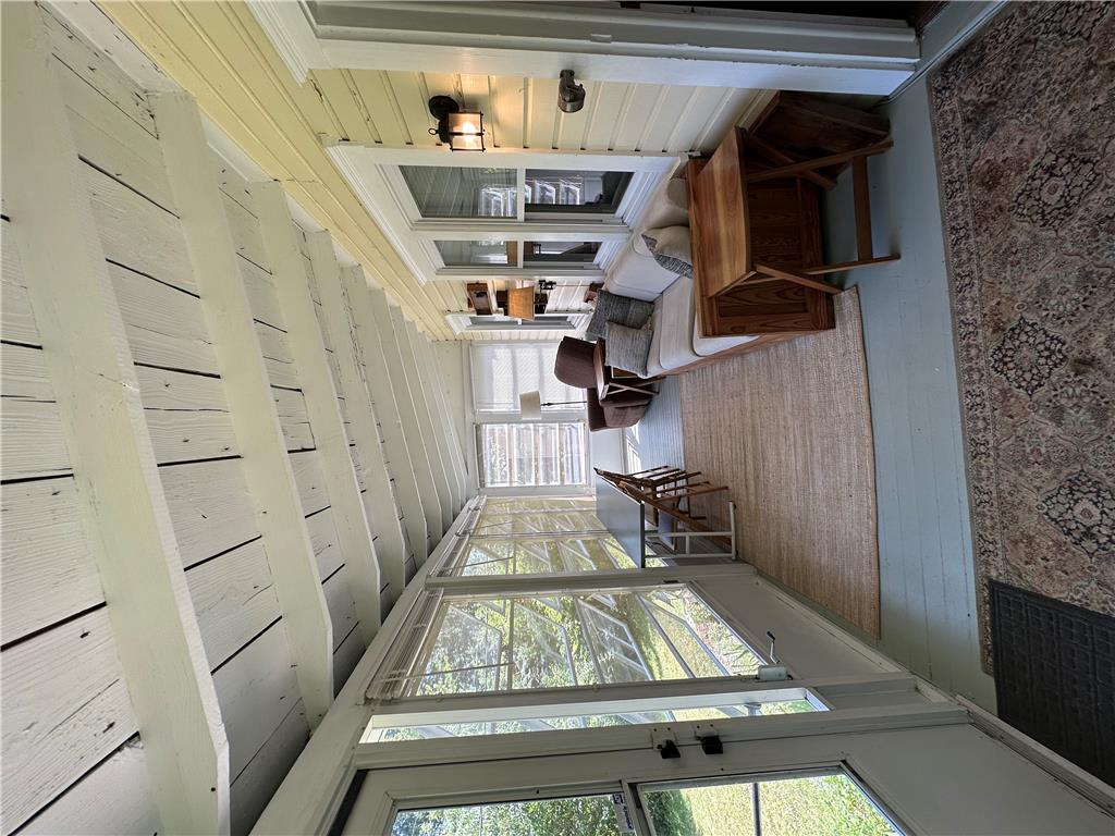 10 Kizer Pond Road Lake Ariel, PA 18436 - Photo 26 of 48 A well-lit sunroom offers panoramic views, creating a serene indoor-outdoor connection.