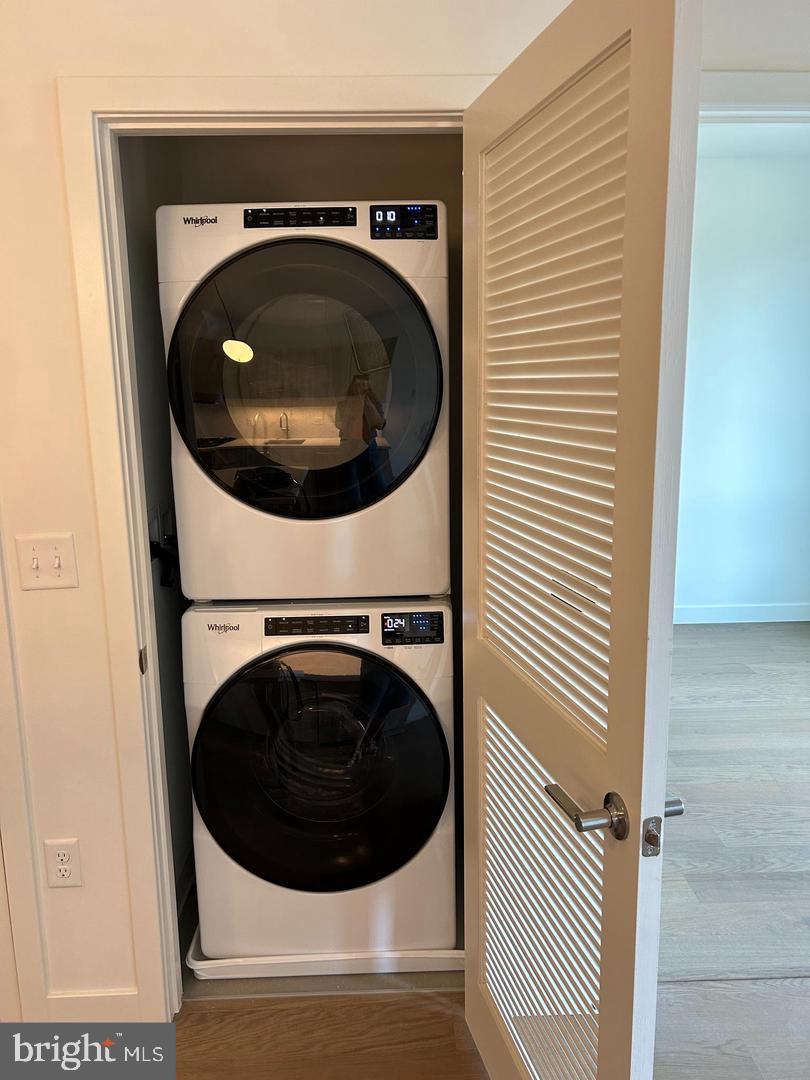 7175 12th Street Northwest, Unit 210 Washington, DC 20012 - Photo 7 of 15 a utility room with dryer and washer