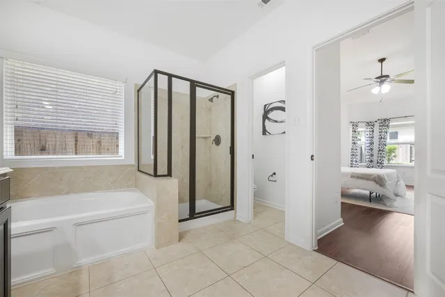 a bathroom with a sink a toilet and a shower