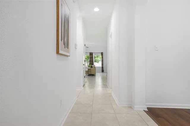a view of an entryway with wooden floor