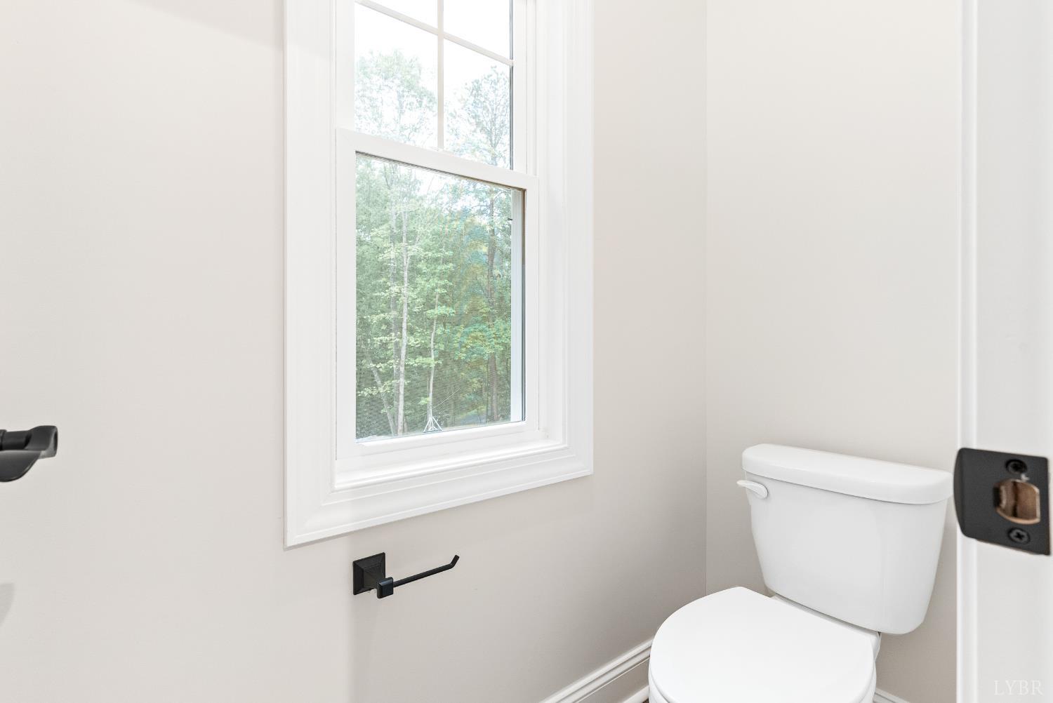 5610 Old Cifax Road Goode, VA 24556 - Photo 21 of 49 a white toilet sitting next to a window