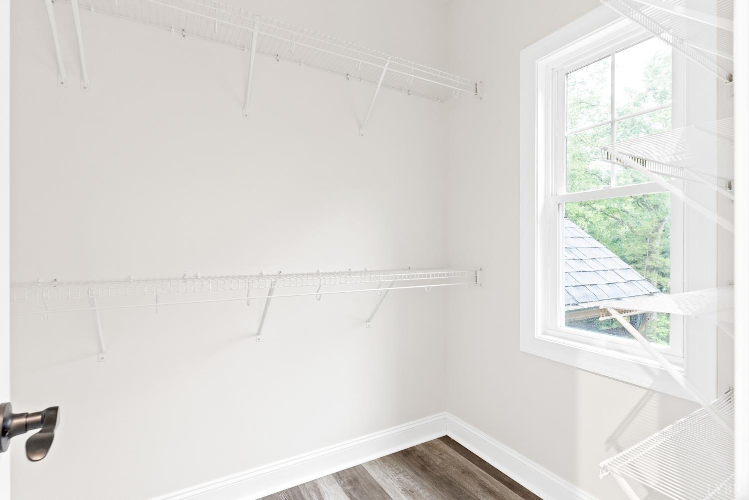 5610 Old Cifax Road Goode, VA 24556 - Photo 22 of 49 a view of a small space with racks on the wall