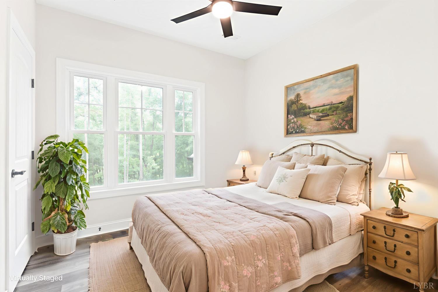 5610 Old Cifax Road Goode, VA 24556 - Photo 25 of 49 a bedroom with a bed and a painting on the wall