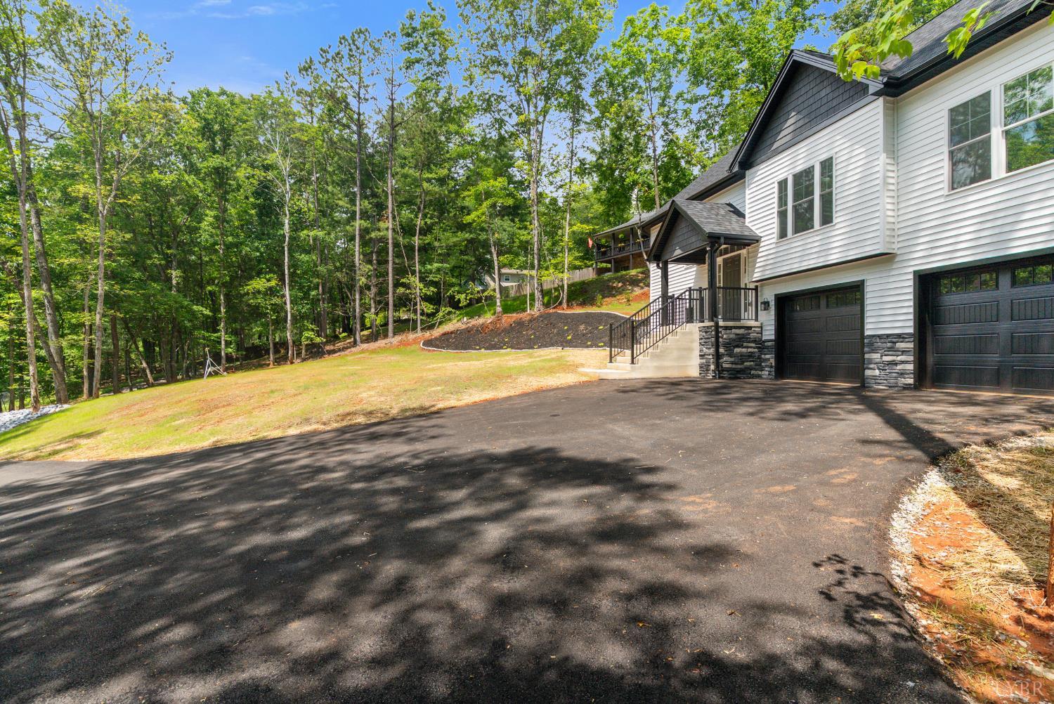5610 Old Cifax Road Goode, VA 24556 - Photo 38 of 49 a view of a house with a backyard and a tree