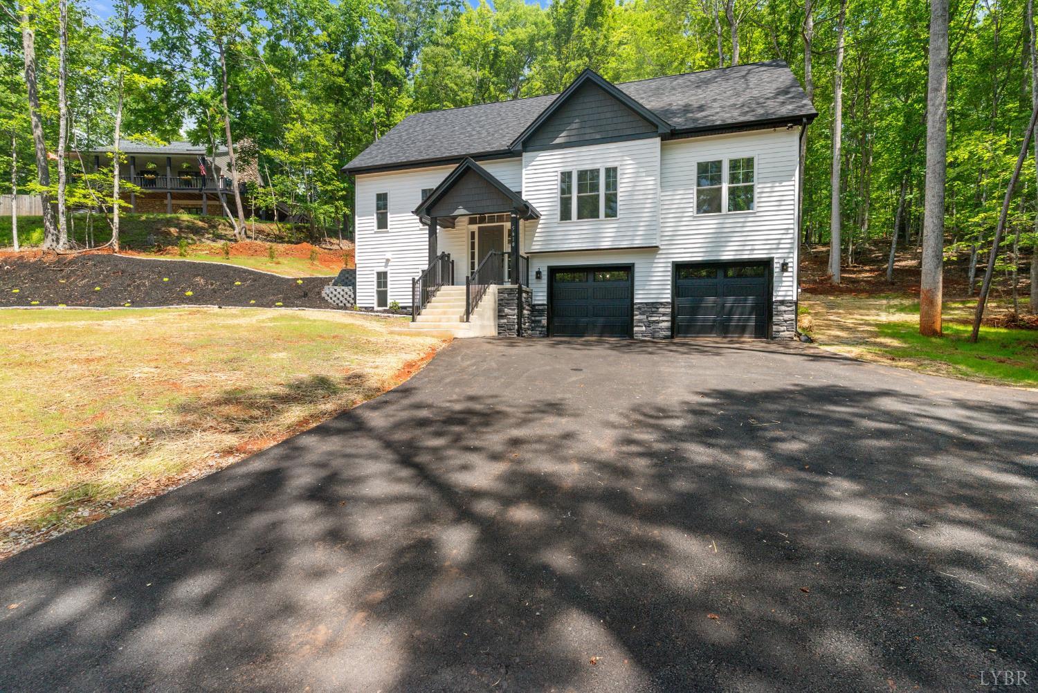 5610 Old Cifax Road Goode, VA 24556 - Photo 40 of 49 a view of a house with backyard and a tree