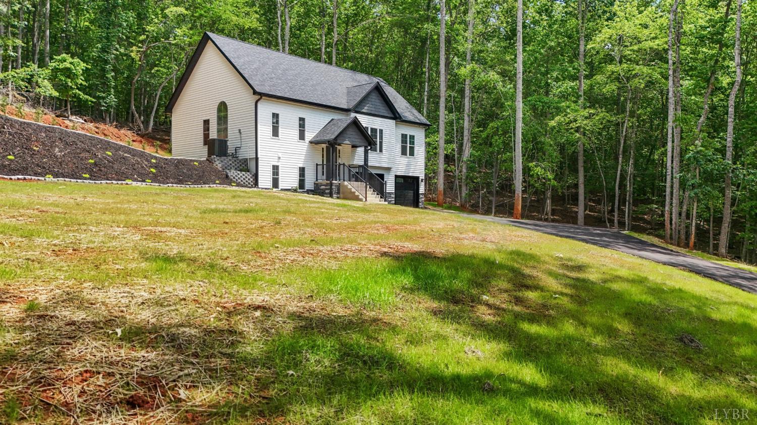 5610 Old Cifax Road Goode, VA 24556 - Photo 41 of 49 a house with huge green field in front of it