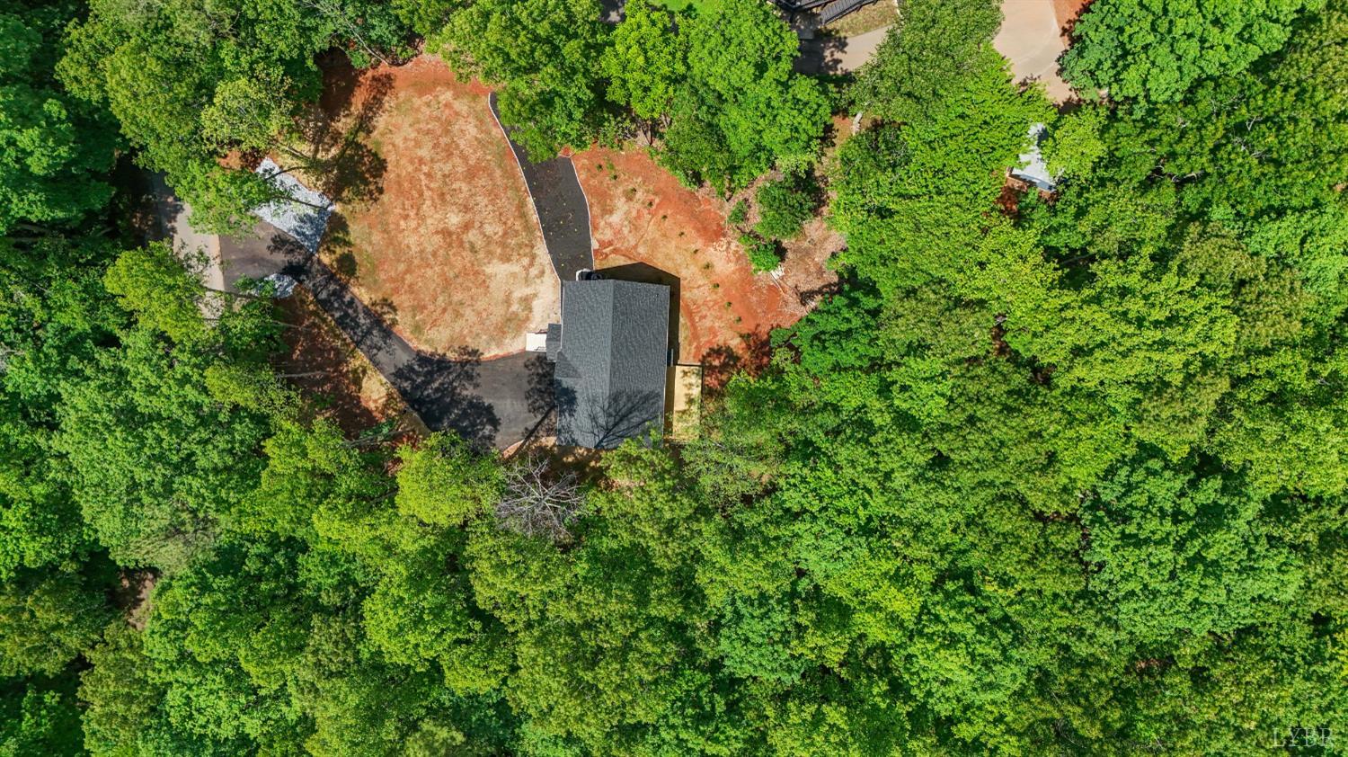 5610 Old Cifax Road Goode, VA 24556 - Photo 44 of 49 an aerial view of a house with a yard and large trees