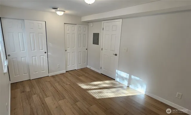 a view of a livingroom with wooden floor