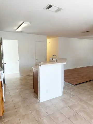 a utility room with a sink washer and dryer
