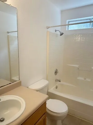 a bathroom with a sink a toilet and a bathtub