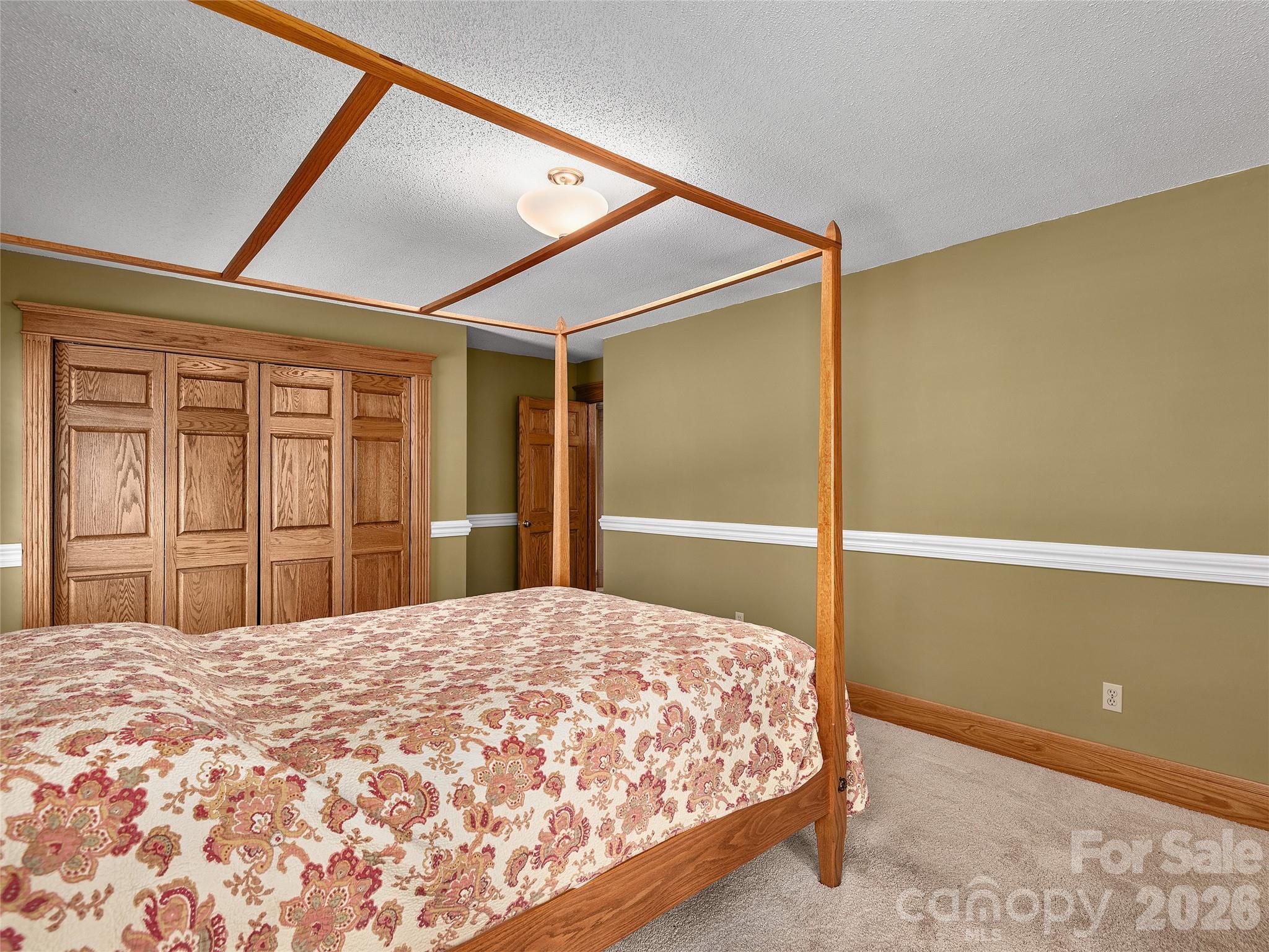 40 Deer Ridge Road Mills River, NC 28759 - Photo 25 of 35 a bedroom with a bed and a dresser