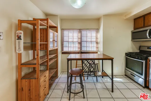 a view of a livingroom with furniture and staircase