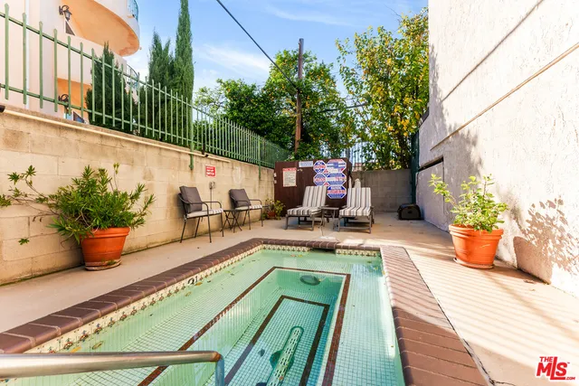 a view of a swimming pool with a patio