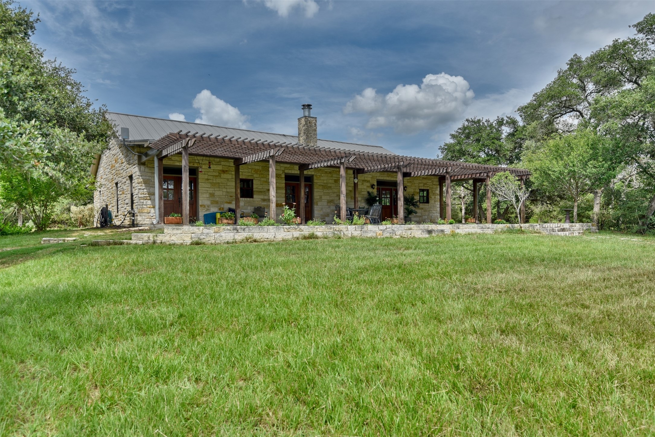 2003 Oak Ridge Road Weimar, TX 78962 - Photo 4 of 35 a front view of house with yard outdoor seating and green space
