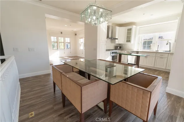 a kitchen with stainless steel appliances granite countertop a refrigerator a sink and a stove