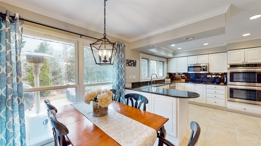 6 Knoll Ridge Road Rolling Meadows, IL 60008 - Photo 13 of 37 a kitchen with stainless steel appliances granite countertop a sink a stove and a refrigerator