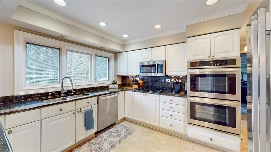 6 Knoll Ridge Road Rolling Meadows, IL 60008 - Photo 14 of 37 a kitchen with stainless steel appliances a stove sink and microwave