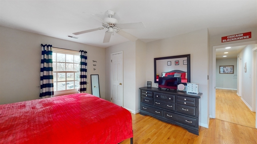 6 Knoll Ridge Road Rolling Meadows, IL 60008 - Photo 22 of 37 a bed room with a bed and a television