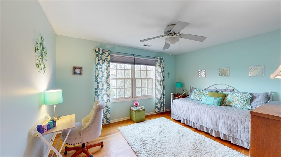 6 Knoll Ridge Road Rolling Meadows, IL 60008 - Photo 24 of 37 a bedroom with furniture and a wooden floor