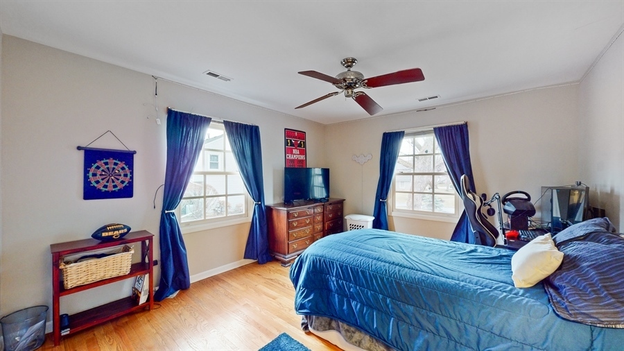 6 Knoll Ridge Road Rolling Meadows, IL 60008 - Photo 25 of 37 a bedroom with a bed and a window
