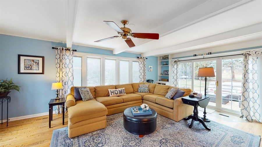6 Knoll Ridge Road Rolling Meadows, IL 60008 - Photo 9 of 37 a living room with furniture a ceiling fan and a window
