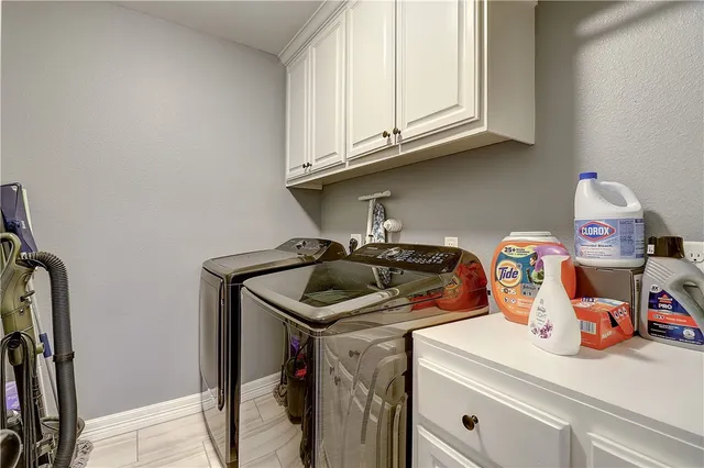 a kitchen with sink and cabinets