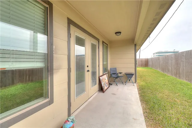 a view of a back yard from a balcony