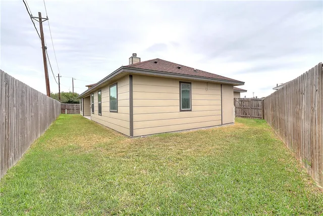 a view of a backyard of the house